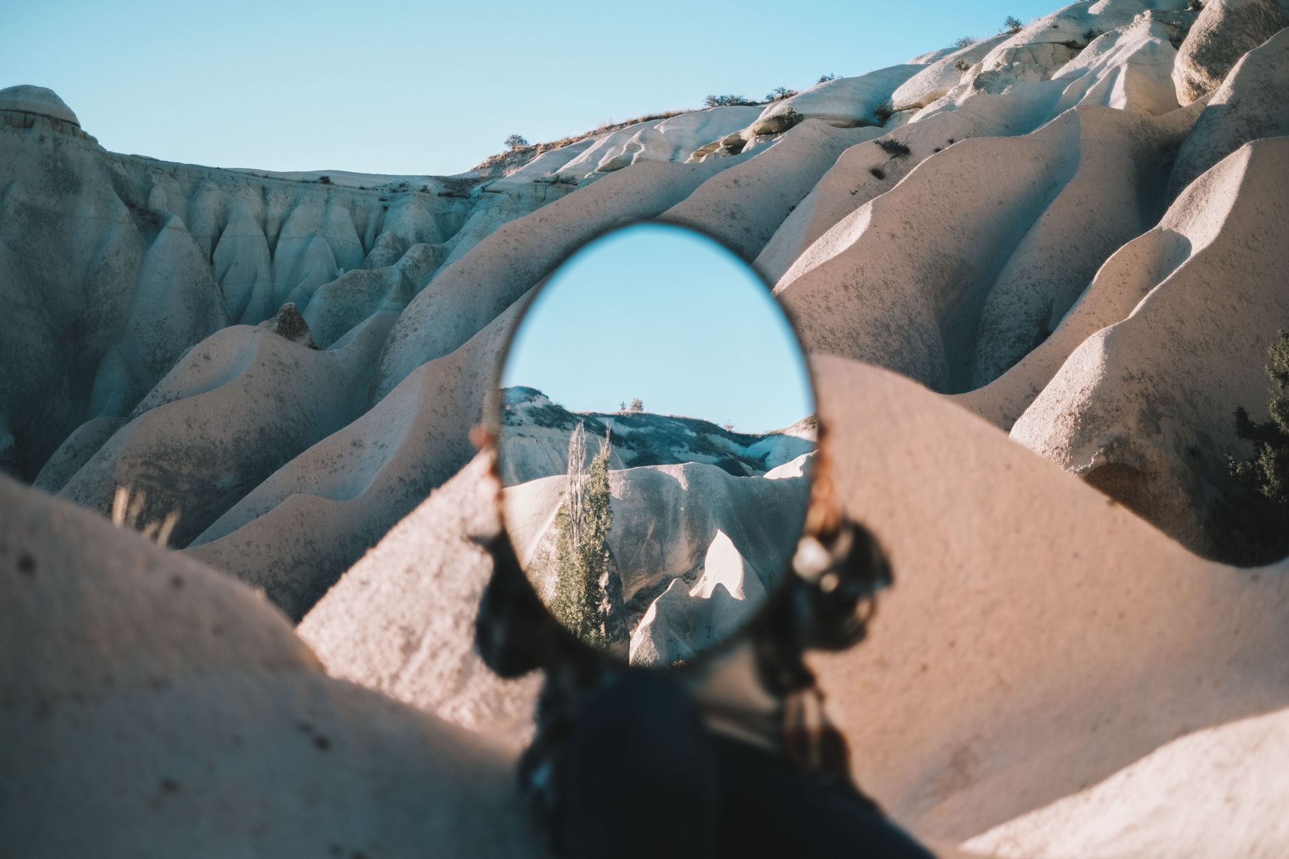 a person holding a mirror